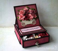 an open box with some flowers in it