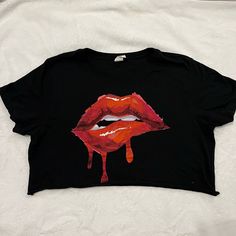 Cropped Lips T-Shirt From Windsor Size Medium. Falls Just Below Bra Line And Fits Size M/L. Never Worn. Trendy Black Cropped T-shirt With Short Sleeves, Trendy Red Crop Top T-shirt, Trendy Red Tops With Graphic Design, Trendy Red Graphic Design Tops, Red Cropped T-shirt With Graphic Print, Casual Black Cropped T-shirt With Graphic Print, Black Grunge Cropped T-shirt For Streetwear, Black Cropped T-shirt With Screen Print For Summer, Black Edgy Crop Top T-shirt