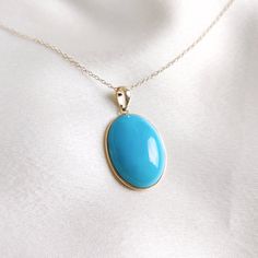 This stunning pendant is set in 14K Solid Yellow Gold with Natural Sleeping Beauty Arizona Turquoise with utmost precision. It is an unique gemstone pendant for nearly every occasion and is completely hassle-free jewelry. 🔷ABOUT GEMSTONE: Turquoise is a vibrant and highly valued gemstone that has been used for its beauty and perceived metaphysical properties. Turquoise is believed to provide protection against negative energies and harmful influences. It is thought to act as a shield, helping t Hallmarked Oval Turquoise Necklace, Yellow Gold Oval Turquoise Necklace Gift, Elegant Oval Turquoise Necklace With Large Pendant, Oval Yellow Gold Turquoise Necklace As Gift, Oval Turquoise Necklace In Yellow Gold As Gift, 14k Gold Turquoise Necklace For Gift, Fine Jewelry Yellow Gold Turquoise Gemstone Necklace, Fine Jewelry Turquoise Gemstone Necklace In Yellow Gold, Fine Jewelry Turquoise Necklace In Yellow Gold