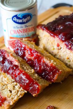 sliced meatloaf with cranberry sauce on cutting board