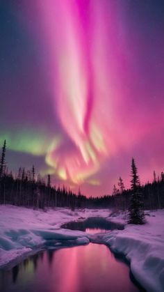 an aurora bore is seen over a frozen lake in the middle of snow covered ground