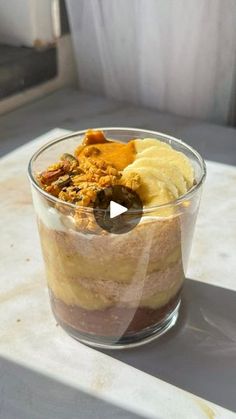 a bowl filled with food sitting on top of a table