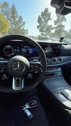 the interior of a mercedes benz s - class coupe with black leather and chrome trim