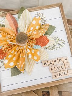 a close up of a card with flowers on it and words written in wood blocks