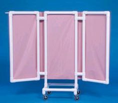 a pink folding screen with wheels on a blue background