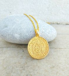 ❣ PRODUCT DESCRIPTION Ancient Greek necklace made of 22k gold plated bronze. Gift yourself with this amazing phaistos disc necklace! This beautiful necklace representing the Phaistos disc from the Minoan Palace on the greek island of Crete. It is dated to the middle or late Minoan Bronze Age(2nd millennium b.C.), covered on both sides with a spiral of stamped symbols.  To this day it is one of archeology's most famous mysteries,Its purpose and meaning,  and even its original geographical place o Greek Necklace, Hypoallergenic Necklace, Cobalt Blue Earrings, Bronze Age, Disc Necklace, Greek Island, Original Gift, Crete, Ancient Greek