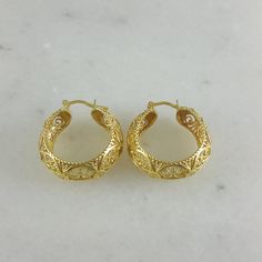 💎 Finely Crafted Jewelry. Made by master goldsmiths in Istanbul in our workshop. ❤️ Enjoy 18K gold for Less! What you see is gold, what touches your skin is 18k gold. ✓ Instant Glamour and Comfort - Statement Hoop Earrings ✓ Classic Timeless Filigree Hoop Earrings Design ✓ Length: 30 mm | 6/5 inch ✓ Width: 10 mm | 2/5 inch 100% Customer satisfaction guaranteed! Hassle free returns or exchanges. Reach out if you have any special requests and we'll make it happen! OTHER INFORMATION ✓ All items ar Gold Oval Earrings With Intricate Design, Gold Diamond Cut Oval Hoop Earrings, Gold Oval Diamond Cut Hoop Earrings, Traditional Gold Diamond Cut Earrings, Oval Gold Hoop Earrings With Diamond Cut, Elegant Gold Huggie Earrings With Diamond Cut, Elegant Gold Diamond Cut Huggie Earrings, Classic Handmade Gold Huggie Earrings, Gold Filigree Small Hoop Jewelry