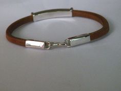 handcrafted  natural leather bracelet. Manually shaped natural brown leather with silver elements and hook clasp.It's a very strong and long lasting  natural leather bracelet, stamped .925 sterling silver.Length of the bracelet-Up to  22.80 cm/9 inches/Width of the bracelet-7.79 mm/0.30inches/Length of the silver element - 43.00 mm/1.69 inches/Height of the silver element-6.83 mm/0.27 inches/Length of the end caps+hook clasp-44.56mm(1.75 inches)Pick   your size and color:Length:  6inches ,6,5inc Leather Bracelet With Palladium Hardware As Gift, Brown Leather Bracelet With Palladium Hardware, Everyday Engraved Brown Leather Bracelet, Everyday Brown Engraved Leather Bracelet, Adjustable Leather Bracelet With Palladium Hardware As Gift, Rectangular Silver Leather Jewelry, Silver Rectangular Leather Bracelet For Everyday, Rectangular Silver Leather Bracelet For Everyday, Everyday Silver Rectangular Leather Bracelet