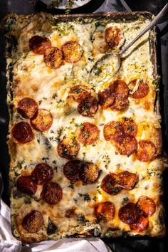 a square pizza sitting on top of a pan covered in cheese and pepperoni