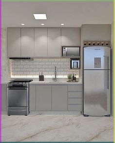 a modern kitchen with stainless steel appliances and marble counter tops