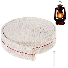 a white rope with red stitching around it and a brown lantern on the side