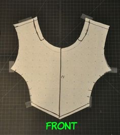 the front and back of a sewing pattern for a top that has been cut out