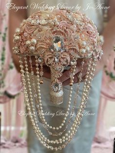 a bridal bouquet is adorned with pearls