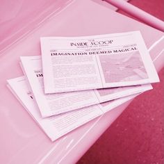 three newspapers stacked on top of each other in front of a pink background with the word inside scoop