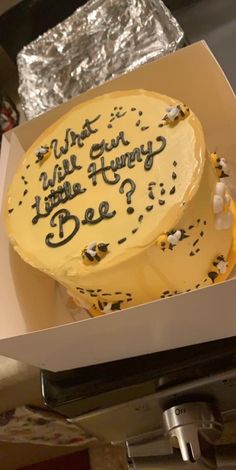 a cake in a box with writing on it