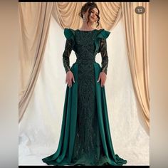 This Dress Is From The Ari Art Designers, It Is A Beautiful Dark Green Color, And Is Custom Made. The Dress Was Only Worn Once. The Dress Is Heavily Beaded And Is Fully Covered So Is Perfect For Hijab. The Measurements Used For The Dress Are, Bust-103.5 Cm Waist- 82 Cm Hips- 116 Cm Height 160 Cm. Elegant Prom Dresses Unique Fitted, Cocktail Dress With Sweep Train And Long Sleeves, Cocktail Long Sleeve Dress With Sweep Train, Green Formal Dress With Sweep Train, Formal Green Dress With Sweep Train, Green Dress With Sweep Train For Banquet, Green Dresses With Sweep Train For Banquet, Long Sleeve Ruffled Gown For Gala, Green Sweep Train Dress For Formal Occasions