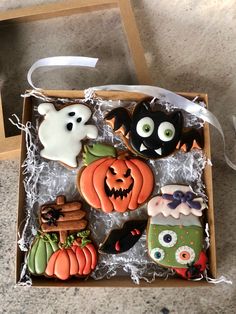 decorated halloween cookies in a box on the floor