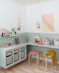 a child's playroom with toys and storage