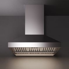 Falmec 1200 CFM Pyramid Wall Mounted Outdoor Range Hood in Stainless Steel  on a modern wall. Outdoor Range Hood, Stainless Range Hood, Outdoor Range, Outdoor Grills, Cooker Hoods, Listen To Music, Range Hoods, Innovative Technology, Outdoor Grill