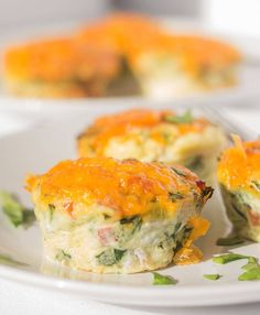 a close up of a plate of food with broccoli and cheese on it