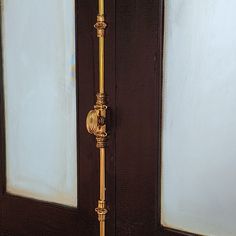 a door handle on the side of a wooden door