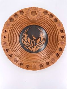 a wooden plate with an intricate design on it