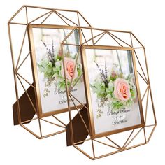 two gold metal frames with pink roses and greenery on them, each holding a photo