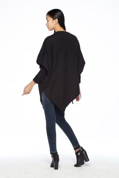 "🚚..ALL ORDERS ARE SHIPPED VIA DHL EXPRESS MAIL This batwing tunic is a very \"cool\" addition to any wardrobe! With a unique drawstrings on bottom hem of tunic provide plenty of options for changing the look. Cowl neckline, batwing sleeves with wide cuffed and oversized side pocket; can be worn layered over leggings, pants, or skirt for even more dramatic effects. * Pull-on style * Cowl neckline * Dropped shoulders * Long sleeves with wide ribbed cuff * Oversize side pocket * Asymmetrical hem Winter Solid Outerwear With Batwing Sleeves, Winter Workwear Top With Asymmetrical Hem, Black Batwing Sleeve Sweater For Layering, Casual Long Sleeve Cape For Layering, Long Sleeve Winter Cape For Layering, Chic Batwing Sleeve Fall Outerwear, Winter Long Sleeve Poncho For Layering, Winter Long Sleeve Cape For Layering, Chic Fall Outerwear With Batwing Sleeve