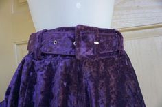 Vintage purple velvety skirt, Size not labeled - estimated XS - please see measurements. In good vintage condition. Measurements taken across front laid flat12" across waist - stretches to 14"21" length Fitted Purple Bottoms With Belt Loops, Purple Velvet Skirt, Dark Purple Mini Skirt, Vintage Purple Cotton Bottoms, Purple Cotton Lined Mini Skirt, Vintage Purple Lined Skirt, Karen Alexander, Waist Stretches, Denim Overalls Shorts