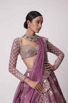 Mud Mauve Sequin And Flower Embroidered Lehenga And Dupatta Clubbed with Real Hand Cut Mirror Embroidered FullSleeve Blouse.From Vvani Vats Jugmug's collection.DELIVERY TIMEPlease allow 8-12 weeks for your outfit to arrive.FABRIC DETAILSLehanga - Organza Dupatta - OrganzaBlouse - GeorgetteProfessional cleaning only. Vani Vats, Sequin Lehenga, Purple Lehenga, Kurta Lehenga, Lehenga Pattern, Mirror Work Blouse, Full Sleeve Blouse, Mirror Embroidery, Weddings Receptions