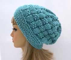 a mannequin head wearing a blue knitted hat