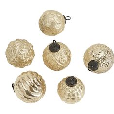 four antique brass door knobs with black buttons on each one and the other side