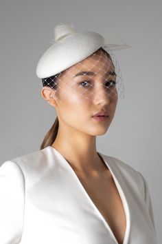 The Isla perch hat is a simple yet elegant wedding hat, made in off-white colour velour felt and finished with a pleated crin detail. The hat can be combined with a veil or worn on its own. * The wedding hat secures with metal combs and a millinery headband, this can be dyed to match your hair colour. * Made to order. * Available in other colours, however, the pleated crin can only be done in off-white or black. How does the veil work? The veil is separate from the headband so it simply gets pin Bridal Hats, Bridal Birdcage Veils, Modern Wedding Gown, Bridal Headdress, Bridal Hat, Wedding Hat, Wedding Fascinators, Cocktail Hat, Luxury Bridal