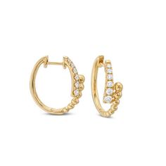 These fashion-forward hoop earrings are delicate and perfect for every day wear. Modern Small Hoop Earrings With Diamond Accents, Everyday Luxury Modern Diamond Hoop Earrings, Elegant Small Hoop Single Diamond Earring, Timeless Small Hoop Earrings With Diamond Accents, Timeless Small Hoop Earrings For Everyday, Elegant Small Hoop Huggie Earrings For Everyday Elegance, Elegant Small Hoop Huggie Earrings For Everyday, Elegant Small Hoop Diamond Earrings For Everyday, Timeless Hoop Earrings With Diamond Accents