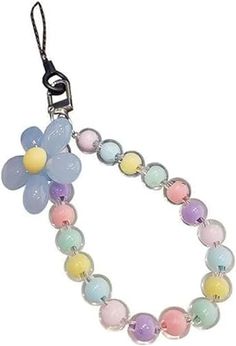 a bracelet with flowers on it and beads hanging from the end of each bead