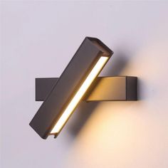 a close up of a wall light on a white background with the lights turned off