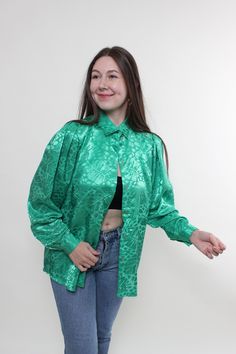 Hi! This is vintage from 80s floral blouse in green color with long sleeves. This vintage bow sleeve green blouse made of POLYESTER. Model on the photo is 170 cm tall and is wearing a LARGE size printed retro blouse. ( 40 - size on the tag). But, be careful, this is a vintage size, it is better to check the measurements below in the product description. Sleeves - 49cm/ 19.29inch; Width - 53cm / 20.86inch;  Length - 72cm / 28.34inch. All measurements are taken seam to seam while lying flat. Addit Green Floral Print Long Sleeve Shirt, Green Tops With Vintage Print, Retro Green Shirt For Spring, Green Vintage Print Blouse For Spring, Spring Green Blouse With Vintage Print, Green Vintage Print Top For Spring, Vintage Green Tops For Fall, Green Long Sleeve Party Blouse, Green Retro Tops With Vintage Print