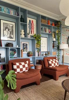 a living room filled with furniture and bookshelves