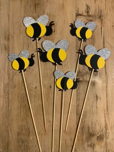 bee cupcake toppers with glitter on them