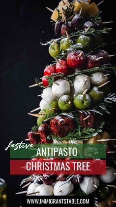 a christmas tree made out of different types of food on skewers with text overlay that reads festi antipasto christmas tree