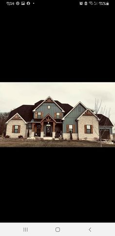 a large house sitting in the middle of a field