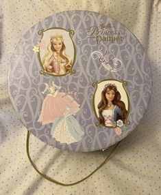 the princess paper plate has pictures of barbie dolls on it's front and sides