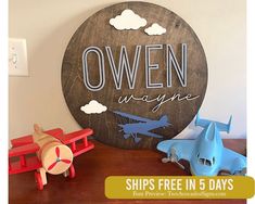 there is a wooden sign that says,'own imagine ships free in 5 days '