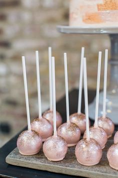 cake pops are lined up on a tray