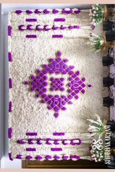 a white table topped with lots of purple decorations