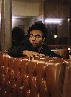 a man sitting at a table in a restaurant