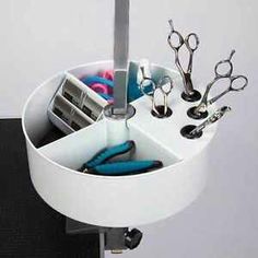 scissors and other office supplies in a holder