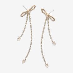 Bead Type: Cubic ZirconiaFeatures: BowEarring Back: PostShape: BowStone Millimeter Measurement: 78 Mm Length, 24 Mm WidthMetal Color: Gold ToneEarring Length: 78mmEarring Width: 24mmCare: Wipe CleanStone Type: 68 Cubic ZirconiaEarrings Type: Post EarringsEarrings Style: Drop EarringsMetal: ZincCountry of Origin: Imported Rhinestone Dangle Earrings As Gift, Cubic Zirconia Earrings With Ear Wire For Party, Party Earrings With Cubic Zirconia And Ear Wire, Dangle Rhinestone Bridal Earrings As Gift, Dangle Bridal Earrings With Rhinestones, Bridal Dangle Earrings With Rhinestones, Party Cubic Zirconia Linear Earrings For Pierced Ears, Earrings Drop, Earrings Color