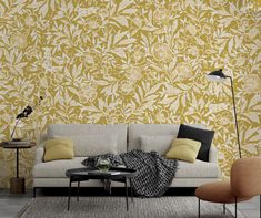 a living room with yellow and white wallpaper