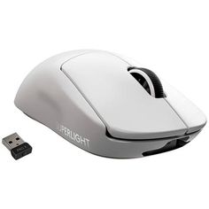 a white computer mouse sitting on top of a desk next to a charger and usb cable